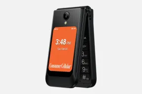 The Consumer Cellular Iris Easy Flip 2 partly open, with the time on an orange outer screen and a camera above it